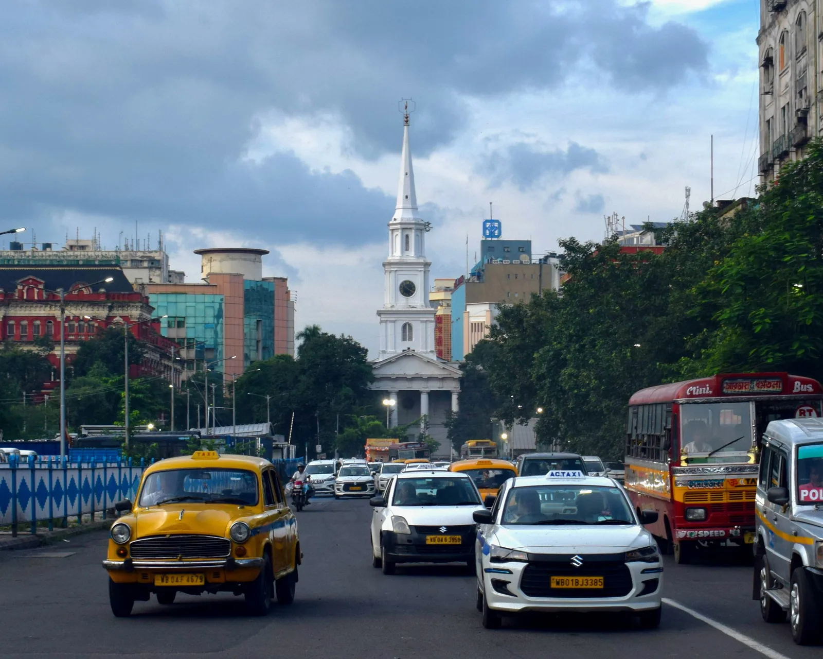 Kolkata street traffic beneath St. Andrew's Church spire