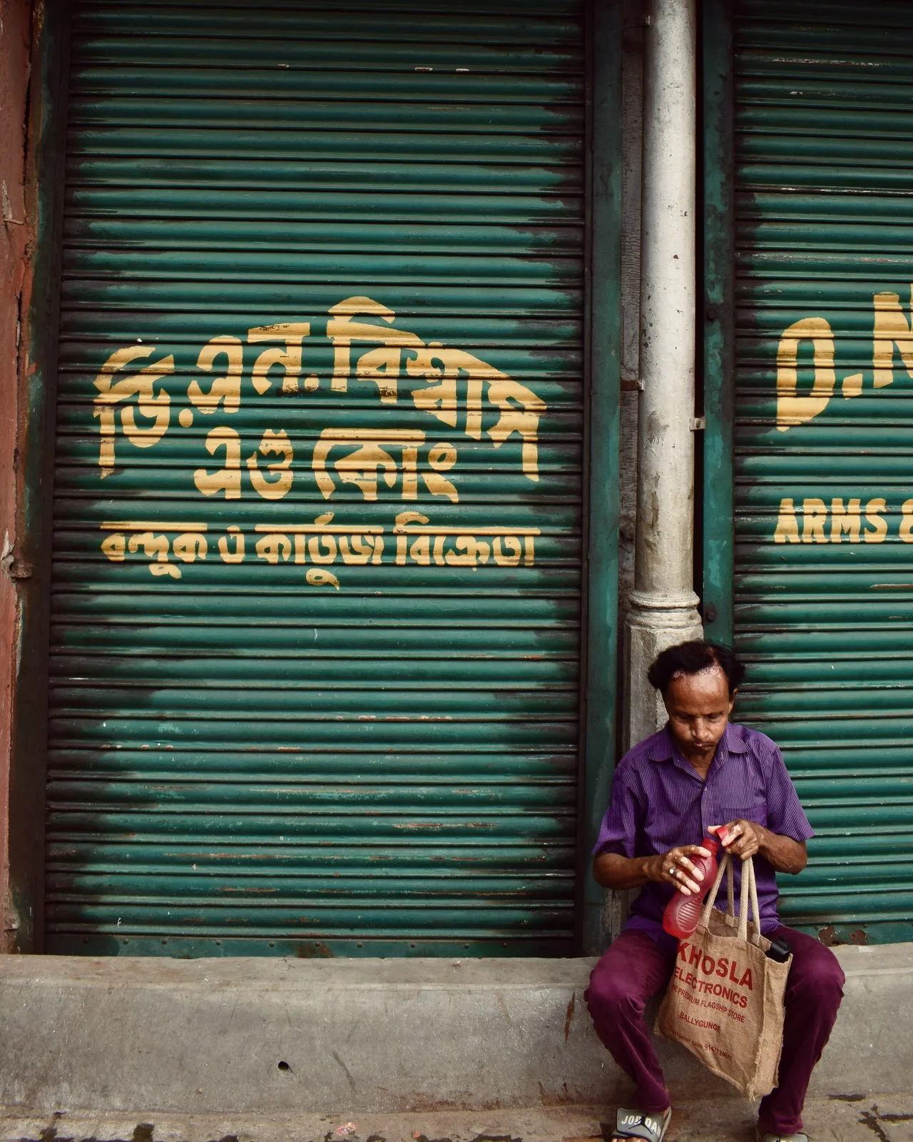 Shuttered gun-and-cartridge shop, old Kolkata street